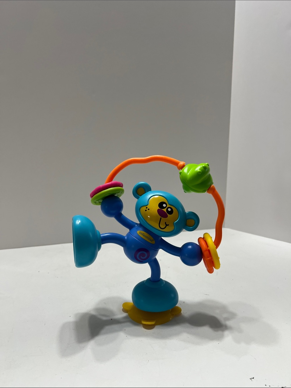 Infantino Blue Monkey Activity Toy with Orange Bead Loop and Yellow Base